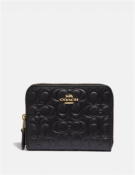 coach black zipper wallet.